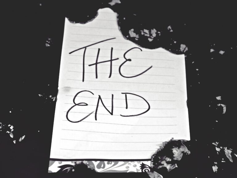 Torn lined notebook paper reading THE END